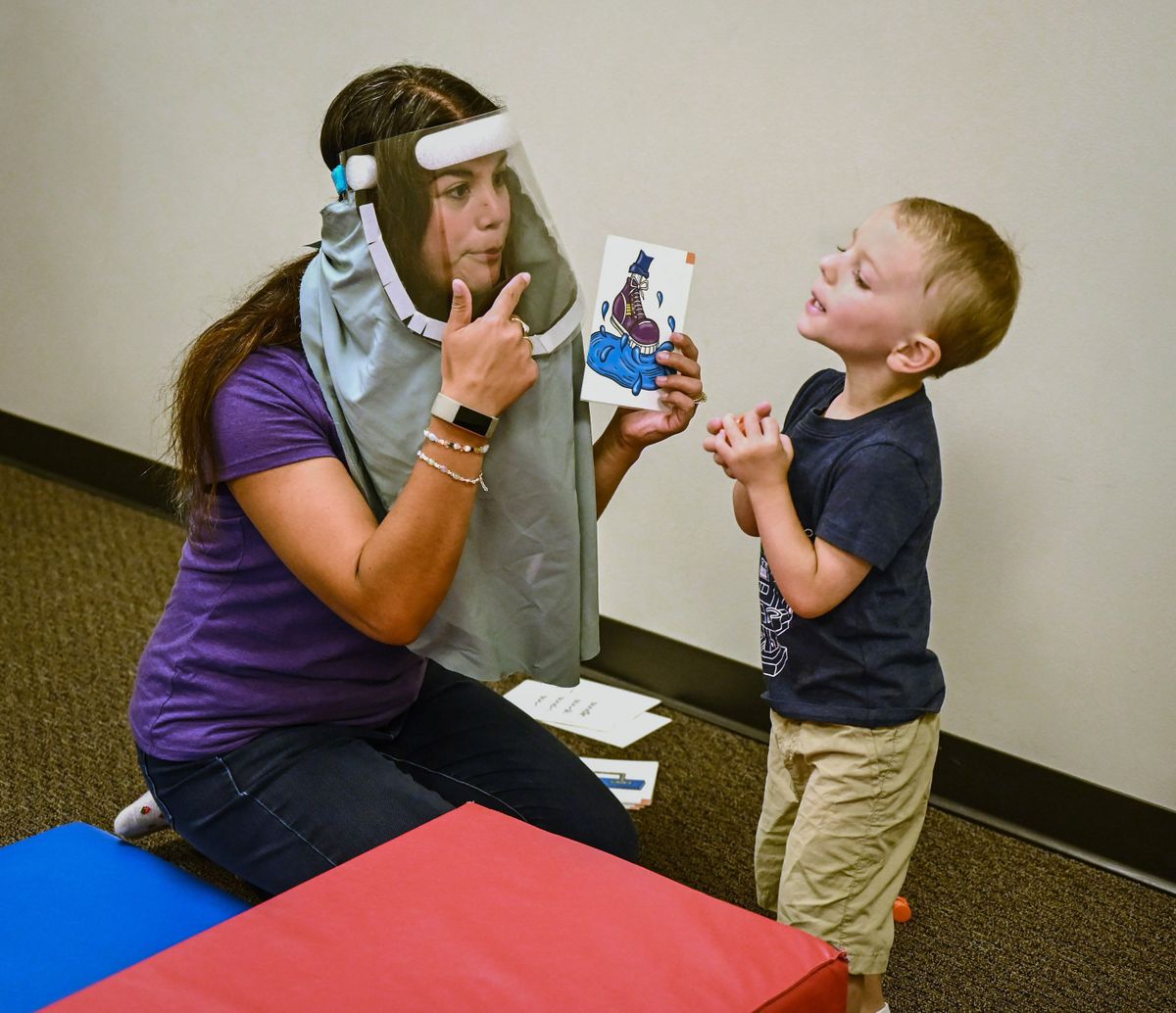 Therapist Gracie Sauramba, of the Center for Pediatric Therapy, works with Tripp Casteel, 3, of Newport, Washington, as the child repeats words during a speech session Tuesday in Spokane. Elevations: A Children’s Therapy Resource Foundation is a nonprofit organization that provides grants for families that can’t afford therapy for their special needs kids.  (Dan Pelle/The Spokesman-Review)