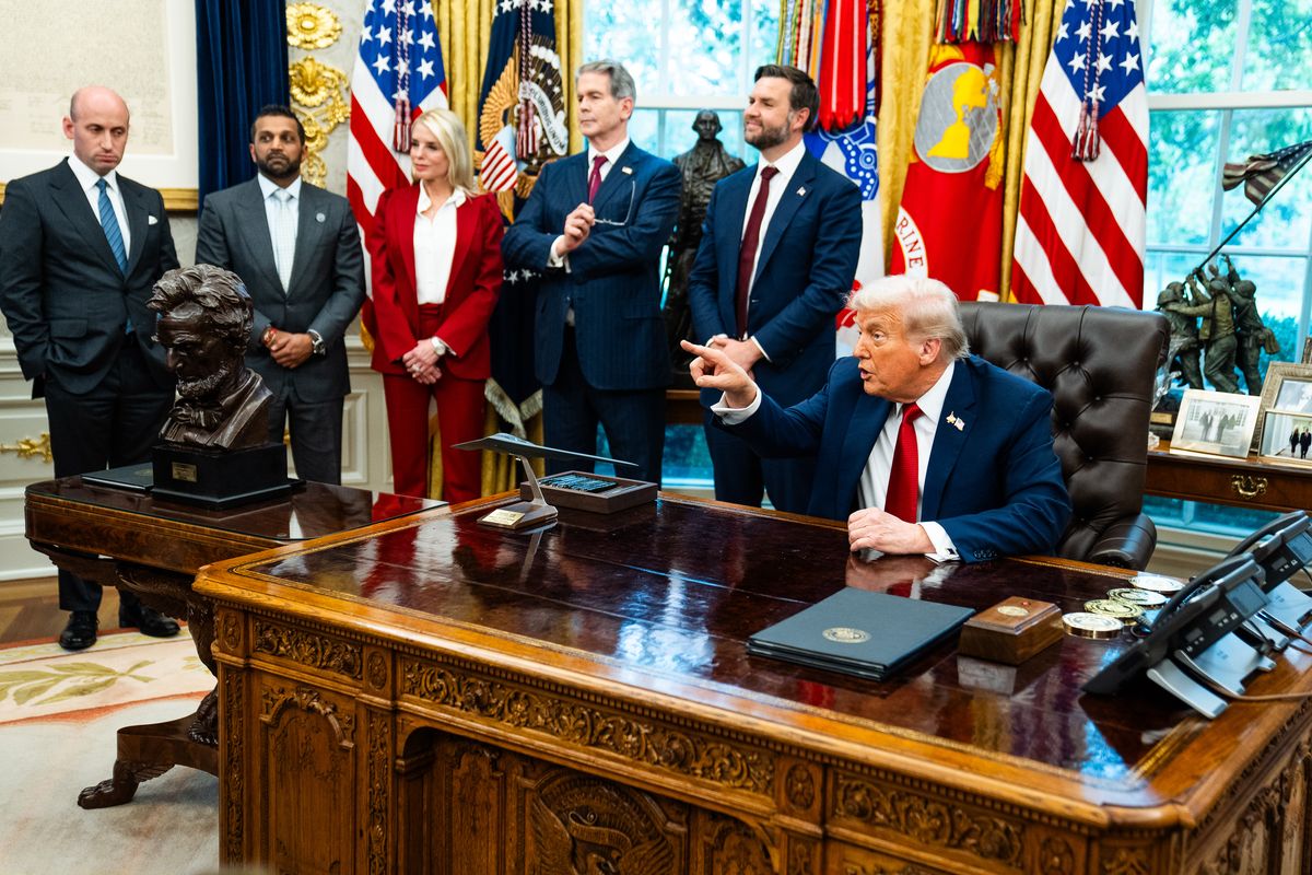 President Donald Trump speaks with the press during the signing of executive orders in the Oval Office on Thursday.    (Demetrius Freeman/The Washington Post)