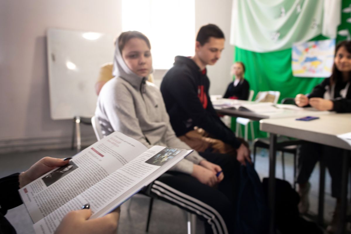 Ukrainian refugees sit for a lecture on March 21, 2022, in an all-Ukrainian school. The school, which is run by Nataliya Kravets, has been open since 2014. However, since Russia invaded Ukraine in February the school