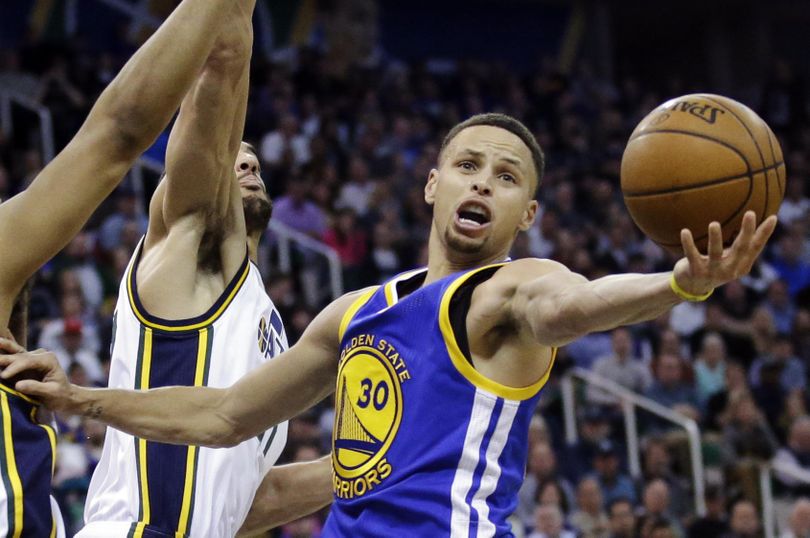 Record-setting Golden State Warriors guard Stephen Curry will be named the NBA MVP for a second straight season a person with knowledge of the award told the Associated Press. The NBA has not revealed the winner. (Rick Bowmer / Associated Press)