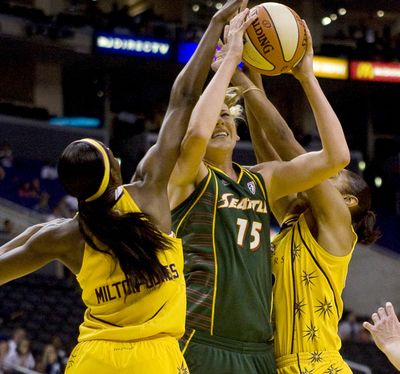 Seattle’s Lauren Jackson draws two Sparks defenders.  (Associated Press / The Spokesman-Review)
