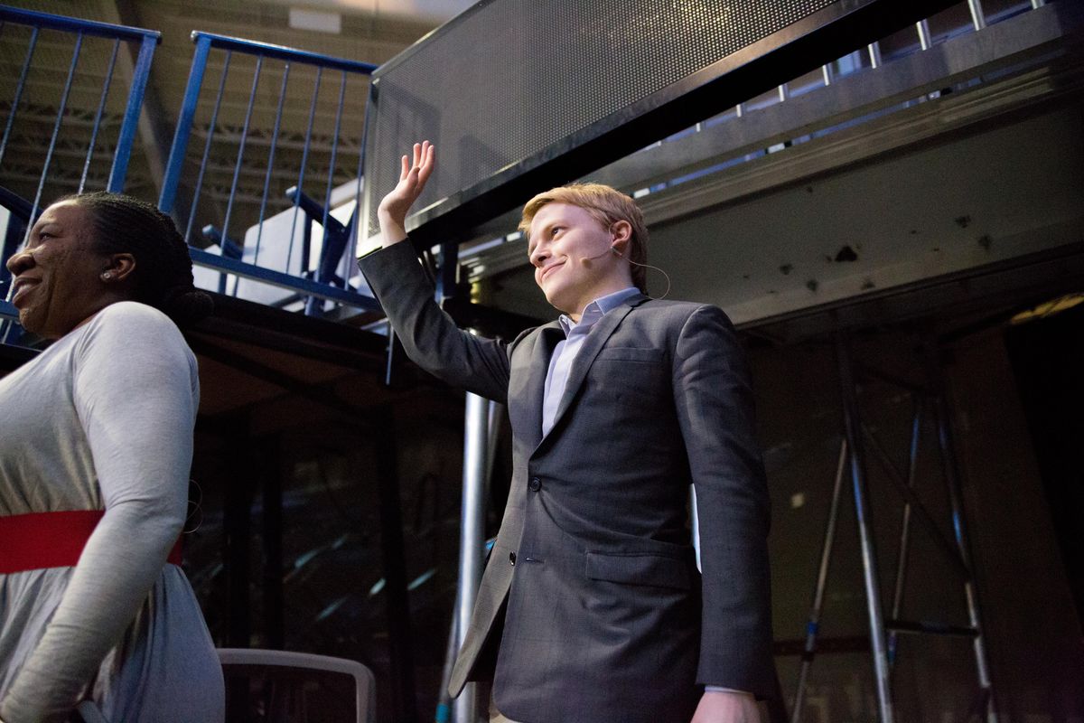 Investigative journalist Ronan Farrow waves to the audience as he enters the floor in Gonzaga’s McCarthey Athletic Center on April 20, 2018 for the Presidential Speakers Series. Farrow spoke alongside activist Tarana Burke, both on the theme “The Power of Social Discourse and the Complexity of the #MeToo Movement.” (Libby Kamrowski / The Spokesman-Review)