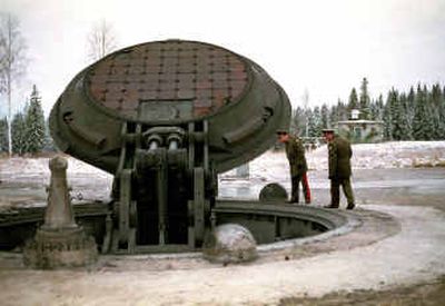 
Russian officials look into a silo of a Russian intercontinental ballistic Topol-M missile in Russia in this 2001 photo. 
 (File/Associated Press / The Spokesman-Review)