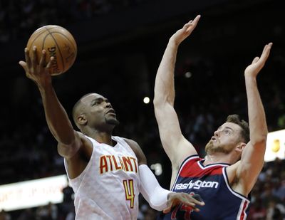 Atlanta Hawks forward Paul Millsap (4) shoots against Washington Wizards forward Jason Smith (14) in the first half of an NBA playoff basketball game in Atlanta. A person with knowledge of the situation told The Associated Press on Sunday, July 2, that Paul Millsap has agreed to terms with the Denver Nuggets on a three-year deal worth $90 million. (John Bazemore / Associated Press)