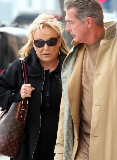 Edra Blixseth arrives at court in Missoula with her boyfriend, actor Jack Scalia, in April 2009.  (Associated Press)