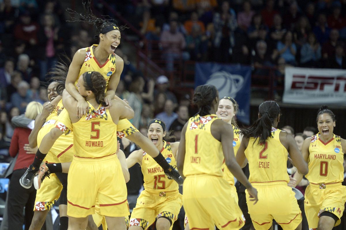 Brene Mosley leaps into the arms of Malina Howard as the Maryland bench erupts after beating Tennessee on Monday. (Jesse Tinsley)
