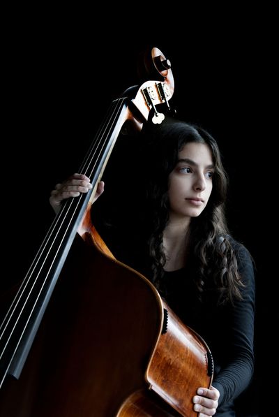 Coeur d’Alene High graduate Samantha Helal is photographed with her second bass at school March 24. She earned the bass, first chair with the Honors Performance Series at Carnegie Hall in 2014. She also has performed with the Coeur d’Alene Symphony. (Kathy Plonka)