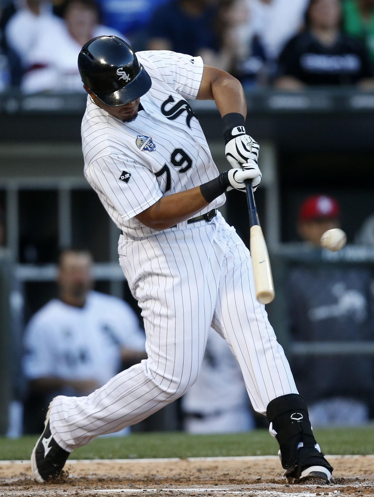 White Sox rookie Jose Abreu hits his 27th home run in the fifth inning. (Associated Press)