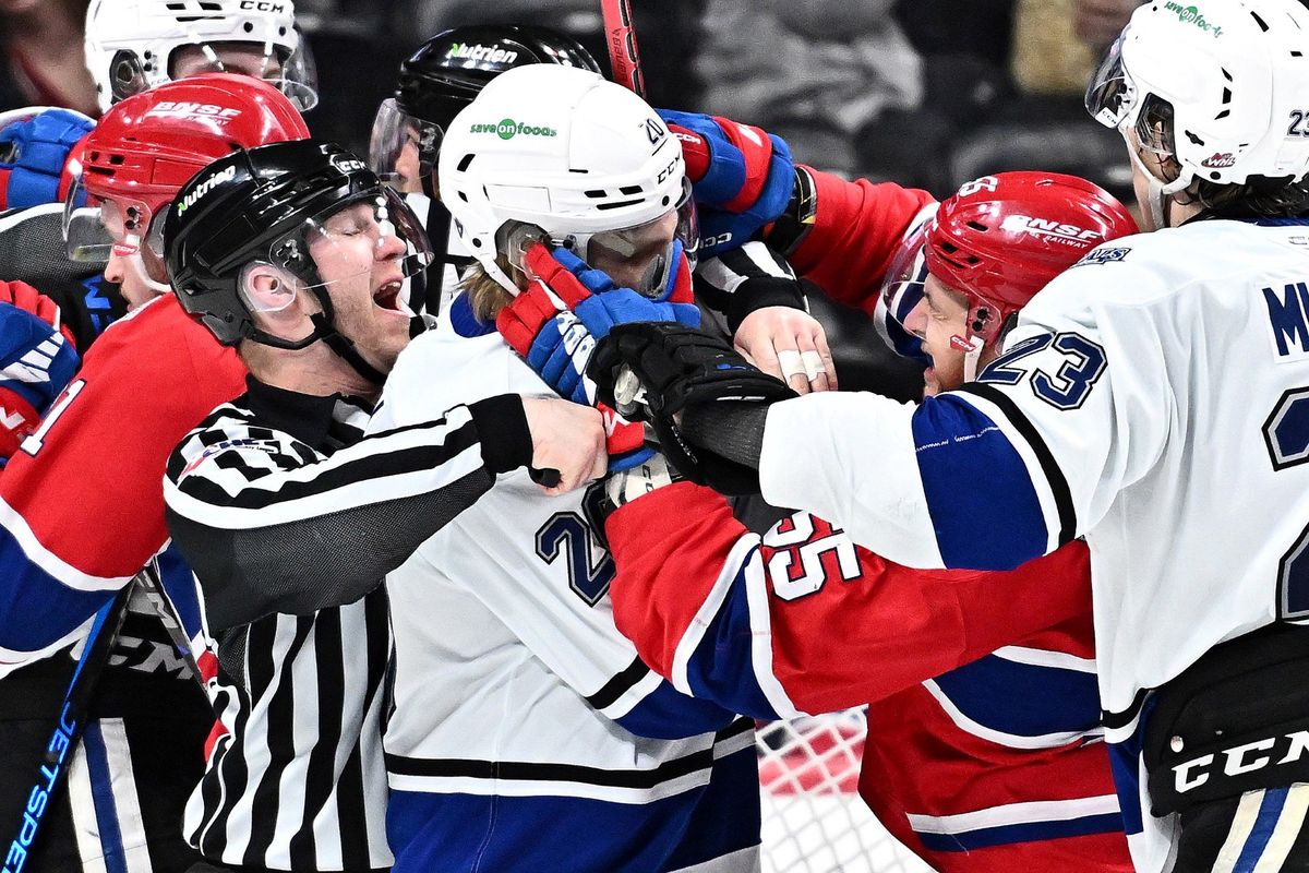 Spokane Chiefs winger Sam Oremba gets tangled up with Victoria Royals center Markus Loponem in the WHL Western Conference semifinal Game 2 at the Spokane Arena on Monday, April 14, 2025. (James Snook)