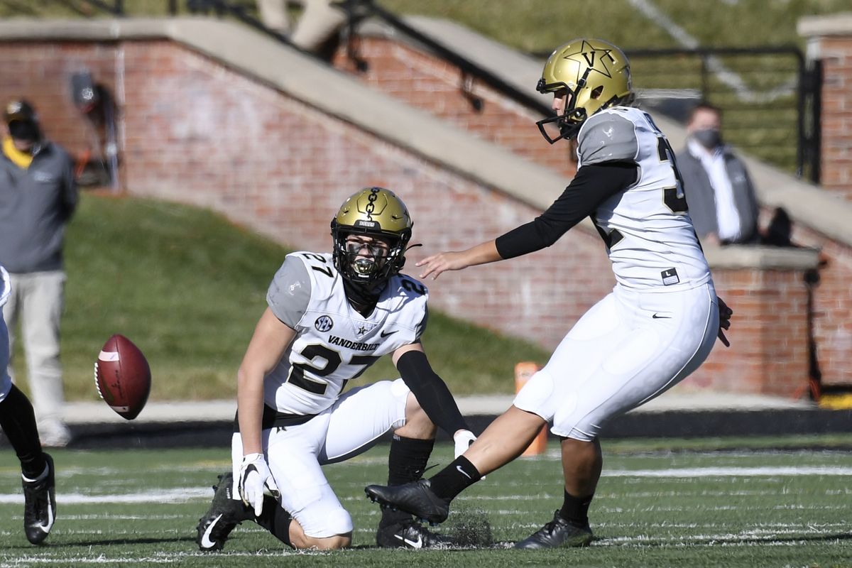 Vanderbilt’s Sarah Fuller kicks off as Ryan McCord holds to start the second half of Saturday’s game against Missouri in Columbia, Mo. Fuller became the first female to participate in a Power Five conference football game.  (Associated Press)