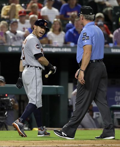 Detroit Tigers' Ian Kinsler, left, argues with crew chief Ted Barrett, right, after Kinsler was ejected by home plate umpire Angel Hernandez in the fifth inning of a baseball game against the Texas Rangers on Monday, Aug. 14, 2017, in Arlington, Texas. (Tony Gutierrez / Associated Press)