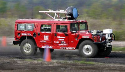 
Carnegie Mellon University's H1ghlander robot snagged the pole position Wednesday in a sequel government-sponsored race across the Mojave Desert that will pit 23 robots against one another. 
 (Associated Press / The Spokesman-Review)