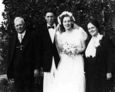 
Newlyweds Paul and Molly Cutting stand with her parents, Albert and Irene Atwood, in Santa Cruz, Calif., on their wedding day, June 30, 1940.
 (The Spokesman-Review)