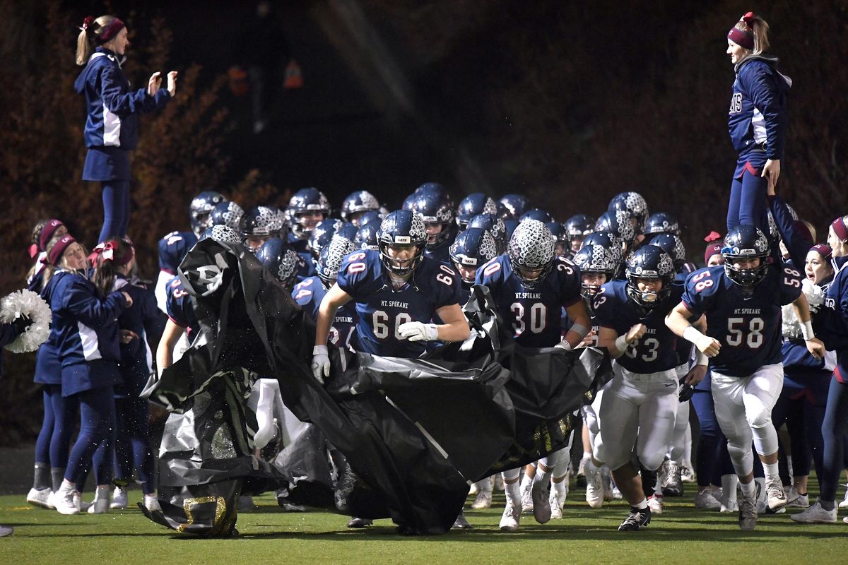 The Mt. Spokane Wildcats take to the field for their playoff high school football game against Peninsula, Fri., Nov. 15, 2019, at Joe Albi Stadium. (Colin Mulvany / The Spokesman-Review)