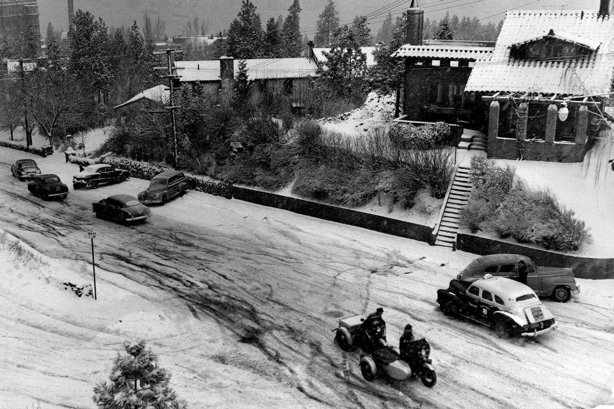 Looking down on Grand Blvd Dec. 16, 1949..The winter of 1949-50 saw 93.5 inches of snow fall in Spokane, the snowiest until 2009, when 93.6 inches fell. Winter driving. Spokesman-Review photo archive. (PHOTO ARCHIVE / SR)