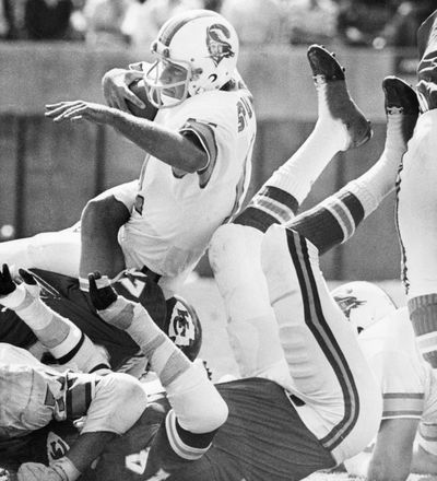 This Oct. 31, 1976, file photo shows Tampa Bay QB Steve Spurrier going down in a pile of Chiefs in Tampa Bay, Fla. The ’76 Bucs went 0-14 and the 2008 Detroit Lions are on the verge of becoming the only winless team since then.  (Associated Press / The Spokesman-Review)