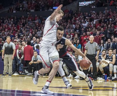 Gonzaga guard Nigel Williams-Goss gave Arizona forward Lauri Markkanen a bump then stepped back and made a clutch jumper late in the second half on Saturday in Los Angeles. (Dan Pelle / The Spokesman-Review)