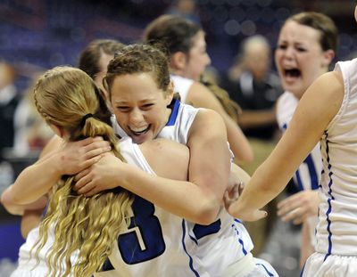 The Colton Wildcats' Savannah Chadwick, facing, hugs Kaden Dahmen after the 1B girls state championship game Saturday, Mar. 2, 2013 at the Spokane Arena.   Colton beat Sunnyside 55-40.  The WIAA 1B/2B Hardwood Classic wrapped up Saturday night in Spokane. (Jesse Tinsley / The Spokesman-Review)