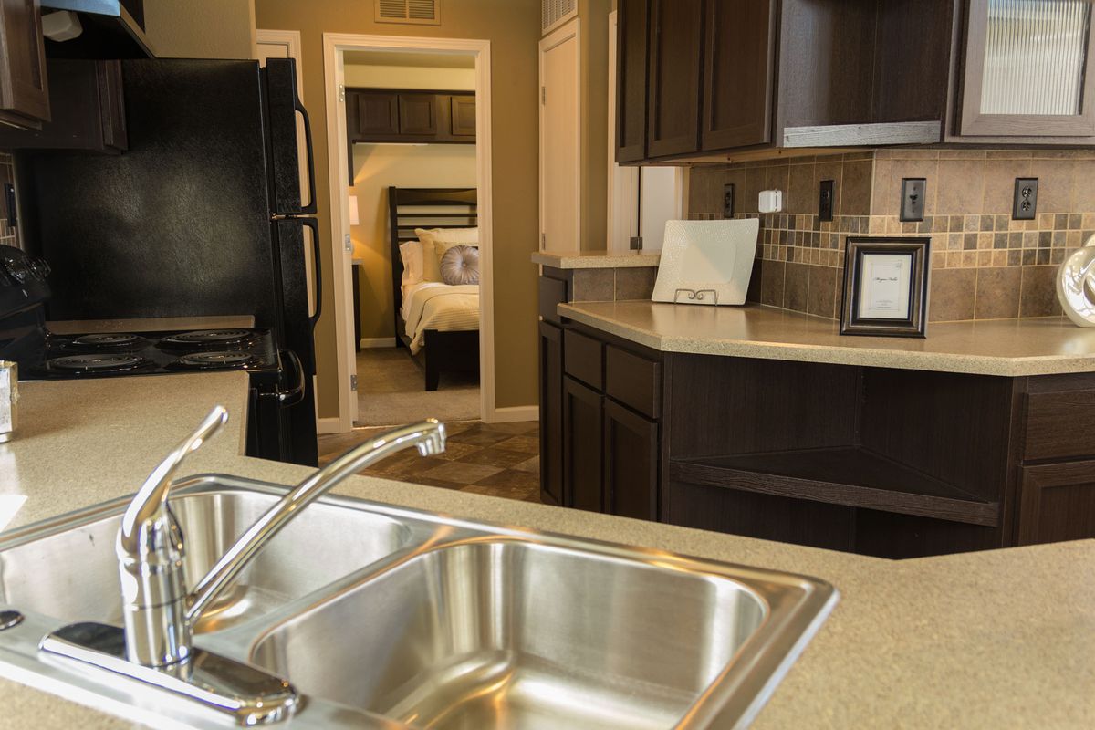 The inside of an elder cottage features a small kitchen, a bedroom, bathroom, living and dining areas, but can be customized to meet individual needs.