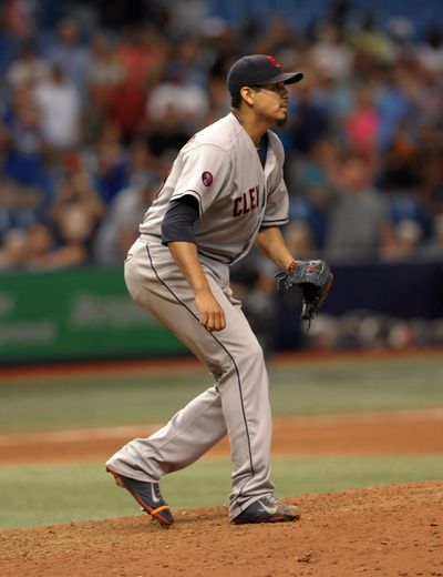 Cleveland’s Carlos Carrasco watches first hit land in the outfield with two outs in the ninth. (Associated Press)