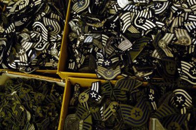 Hundreds of military patches fill the boxes in Marie's Tailor Shop in Airway Heights.
(The Spokesman-Review)