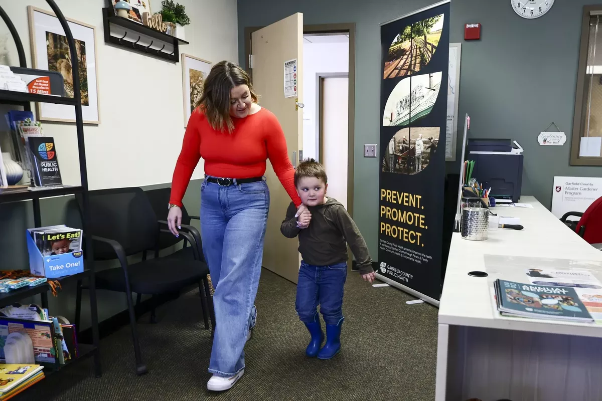 Chelsey Eaton, program coordinator at Garfield County Public Health, has her son, Noah, at her office in Pomeroy. Without other options for child care, Noah sometimes goes to work. (Kevin Clark/Seattle Times)
