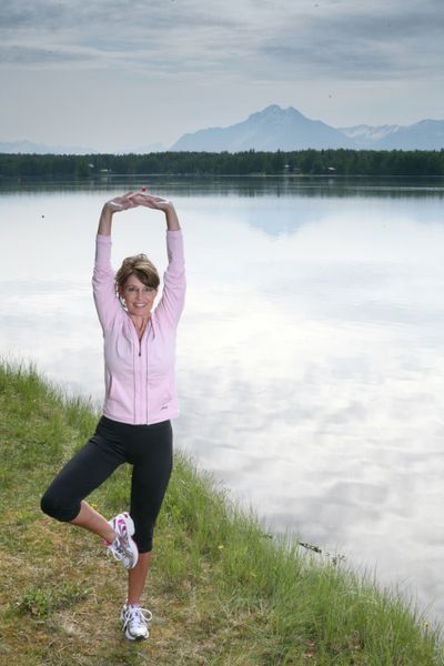 ORG XMIT: AK501 This May 2009 photo provided by Runner's World magazine shows Alaska Gov. Sarah Palin in a yoga pose near her home in Wasilla, Alaska. Palin says she'd come out ahead if she went one-on-one with fellow jogger President Barack Obama in a long run, according to an interview published online Tuesday, June 30, 2009. (AP Photo/Runner's World, Brian Adams) (Brian Adams / The Spokesman-Review)