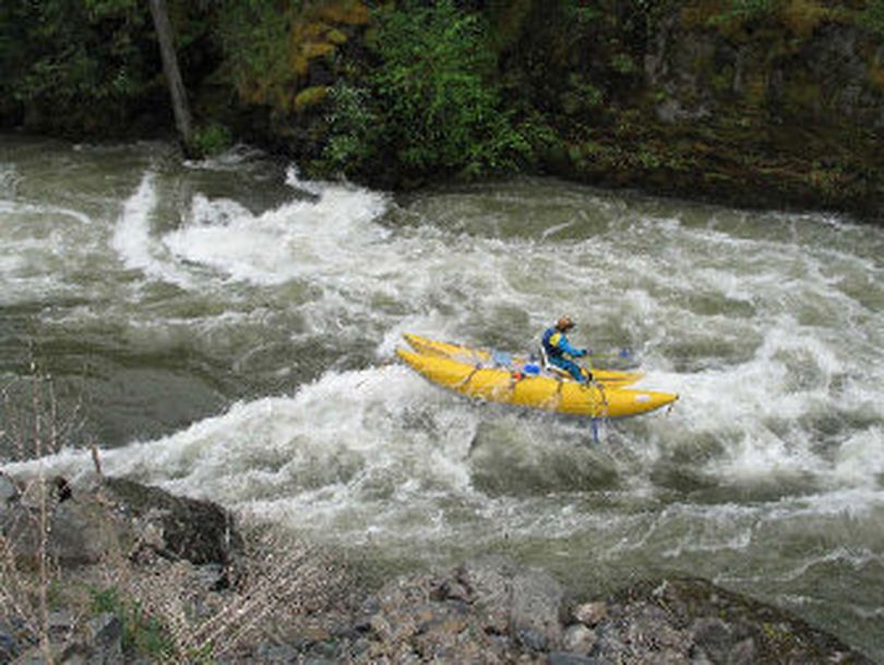 Don Kole of Avery runs his cataraft down Skookum Canyon on the St. Joe River with the river running at 12,000 cfs. 
 (Rich Landers / The Spokesman-Review)