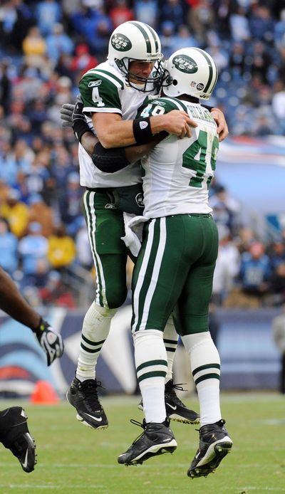 Brett Favre, left, and Tony Richardson celebrate a Jets TD. (Associated Press / The Spokesman-Review)