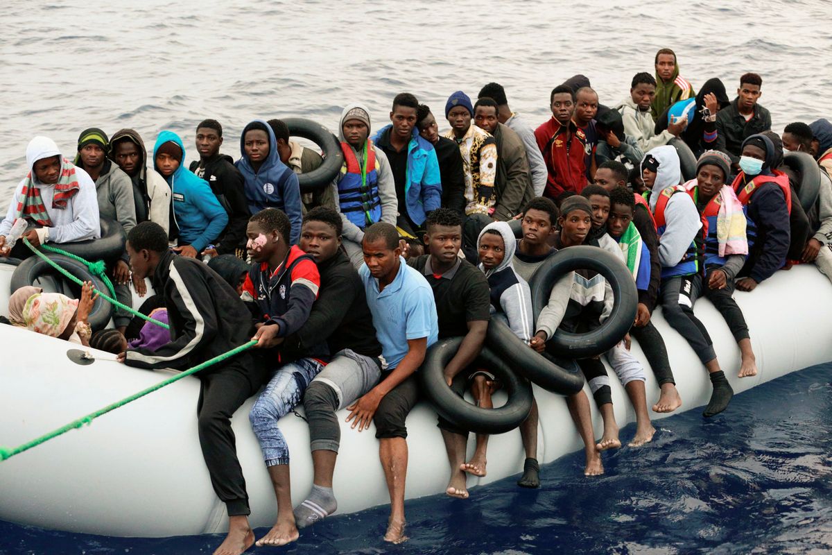 Migrants are brought to shore on Oct. 18 after being intercepted by the Libyan coast guard on the Mediterranean Sea in Garaboli, Libya.  (Yousef Murad)