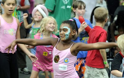 Chanelle Bridges, 5, of Spokane, moves to the beat during dance lessons by Pony Tales Youth Services on Saturday in Riverfront Park.  (Dan Pelle / The Spokesman-Review)