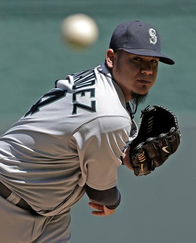 Felix Hernandez, who left in the seventh with a “spasm,” got no support from the M’s. (Associated Press)