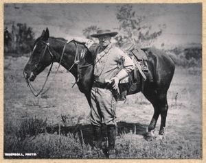 Theodore Roosevelt stands with a saddled horse in the Badlands of Dakota Territory in 1884. Roosevelt originally came to what is now North Dakota to hunt buffalo and was enamored with the rugged, beautiful territory of the badlands. (Theodore Roosevelt Center)