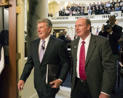 Idaho Gov. Butch Otter, left, leaves the House chambers with House Majority Leader Mike Moyle, R-Star, after delivering his State of the State address Jan. 11, 2016 at the state Capitol building in Boise. (Otto Kitsinger / Associated Press)