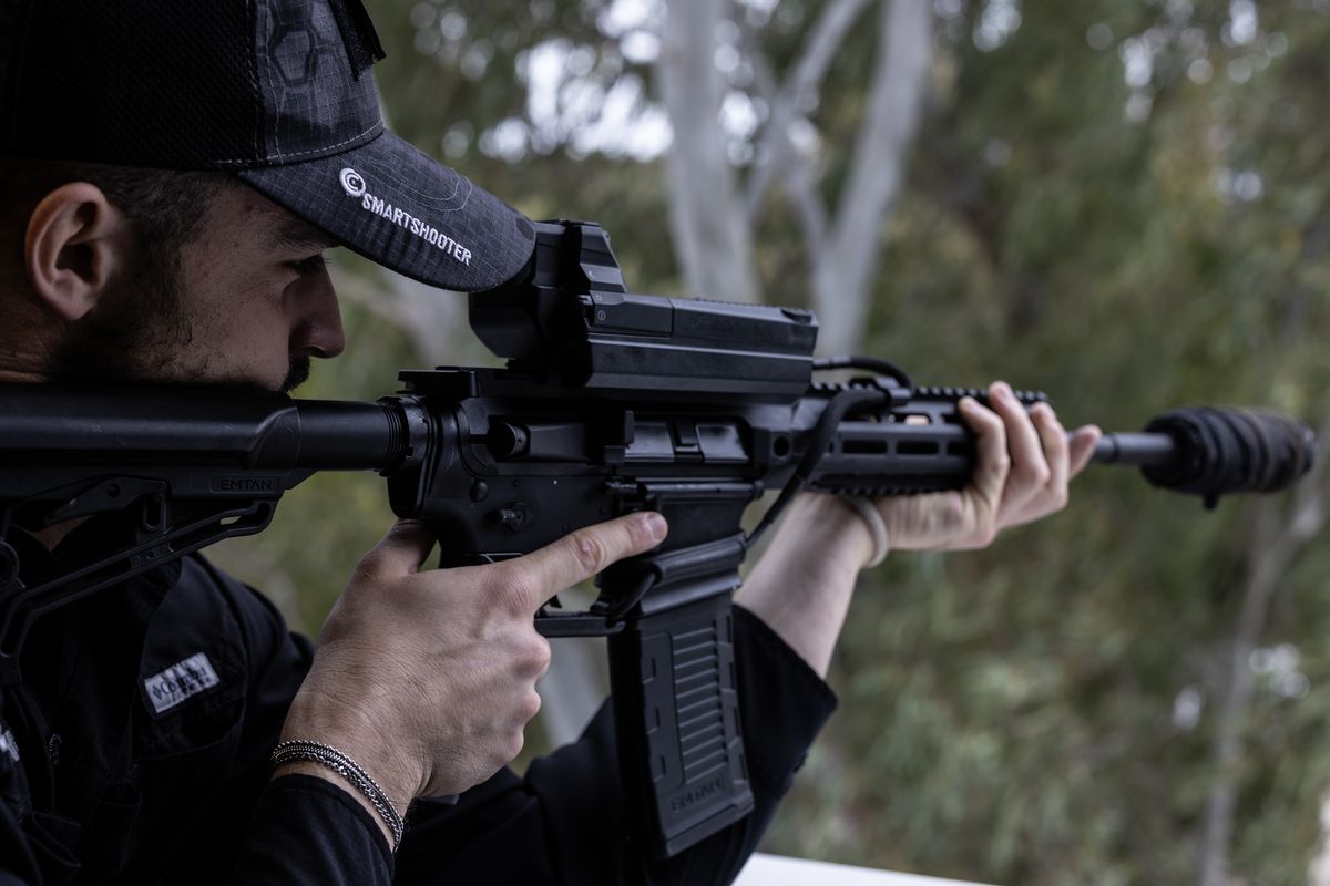 A SmartShooter employee demonstrates the company