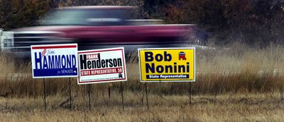 These leftover campaign signs were on Highway 41 in Post Falls on Wednesday.  (Kathy Plonka / The Spokesman-Review)