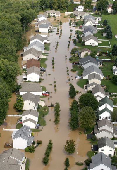 Floodwater from the Susquehanna River hits Scott Township, Pa., Friday. (Associated Press)