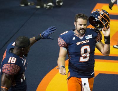 Spokane Shock quarterback Erik Meyer (9) comes off the field after scoring a touchdown against the Arizona Rattlers in the second quarter during an AFL game in the Spokane Arena, Sat., July 12, 2014. (Colin Mulvany / The Spokesman-Review)