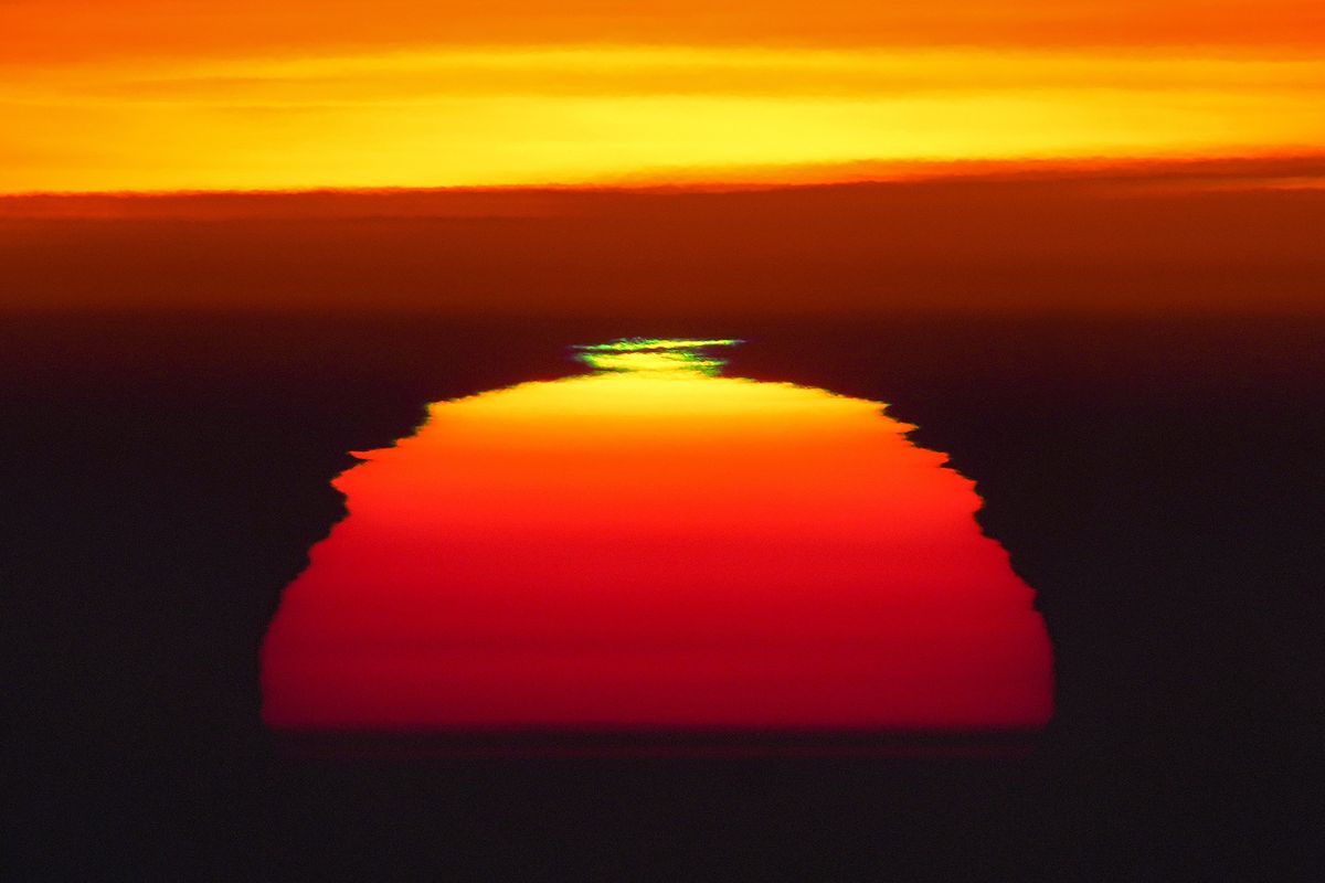 The sun rises through the thick fog that covers the city of Frankfurt, Germany, on Nov. 12.  (Michael Probst)