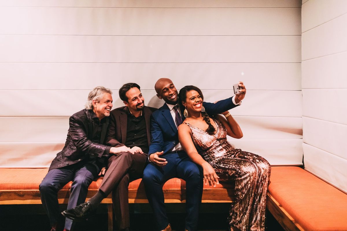 Rebecca Covington and Donald Webber Jr., right, pose with “Hamilton” star Lin-Manuel Miranda and his father, Luis Miranda, on the closing night of “Hamilton’s” run in Puerto Rico in 2019.  (Emilio Madrid)