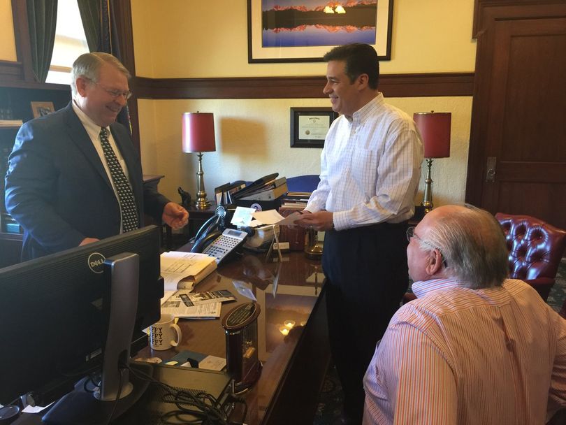 Raul Labrador, center, submits campaign filing forms to Idaho Secretary of State Lawerence Denney, left, in Denney's office on Tuesday morning; at right is Labrador's campaign treasurer, Milford Terrell. (Posted on Twitter by Labrador)
