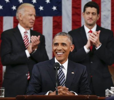 Vice President Joe Biden and Speaker Paul Ryan of Wisconsin applaud President Barack Obama during the State of the Union address before a joint session of Congress on Capitol Hill in Washington on Tuesday. (AP Photo/Evan Vucci, Pool)