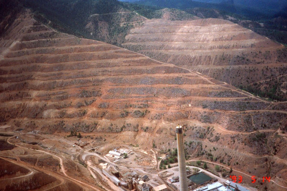 Before: This photo provided by Ed Pommerening shows bare hills near the Bunker Hill lead smelter before reforestation.