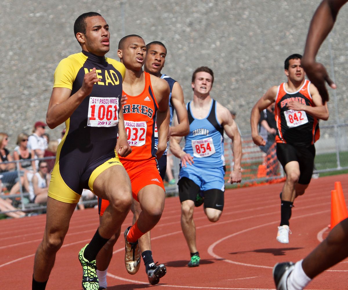 Mead’s Wes Bailey, left, won the 400 with a time of 48.69 at the Pasco Invite at Edgar Brown Memorial Stadium. (KAI-HUEI YAU)