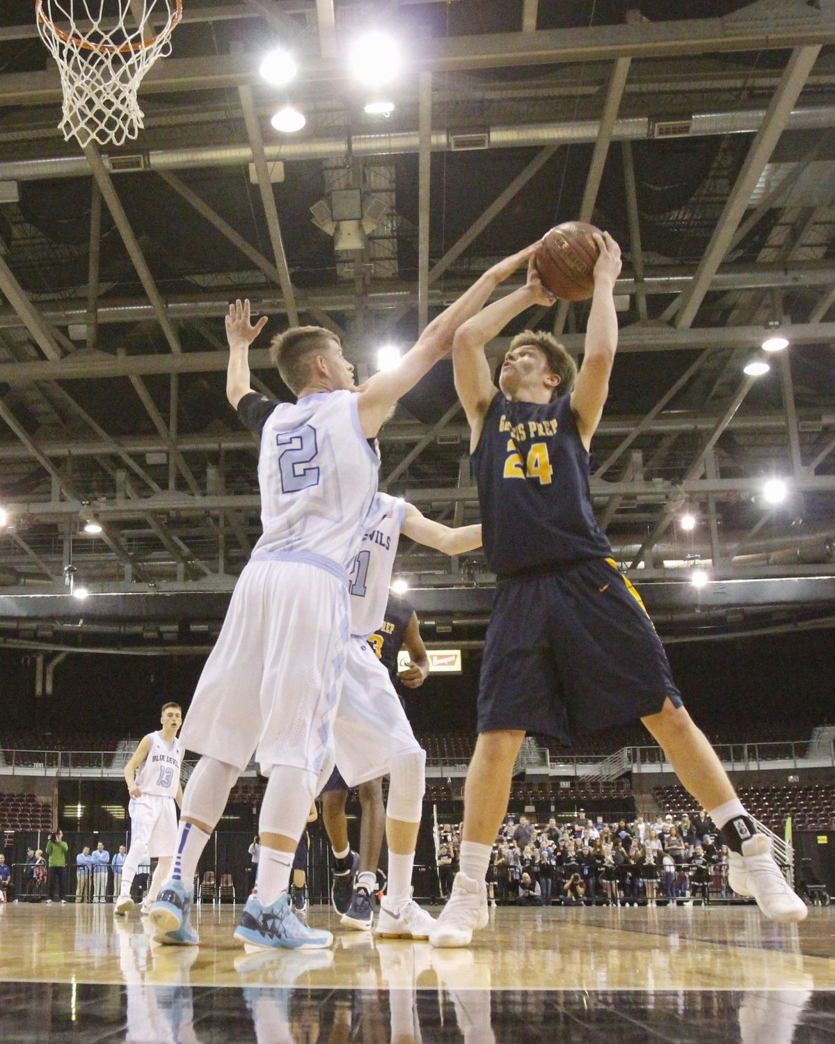 Genesis Prep’s Jonny Hillman looks to the basket over Dietrich’s Kaden Tew during the 2017 state championship game in Nampa, Idaho. (Otto Kitsinger / AP)