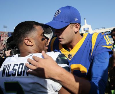 Los Angeles Rams quarterback Jared Goff, right, hugs Seattle Seahawks quarterback Russell Wilson after the Rams’ loss during an NFL football game in Los Angeles. The Rams cannot clinch the division with a victory over the Seahawks on Sunday, Dec. 17, 2017, but would come close to wrapping up the division title and deliver a serious blow to Seattle’s playoff hopes. (Jae C. Hong / Associated Press)