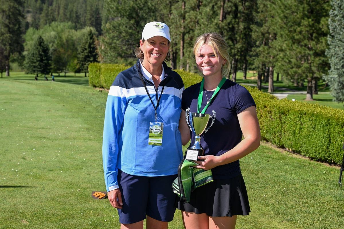 Former LPGA golfer Wendy Ward and Mead’s Brooke Bloom pose for a photo with the Kalispel Championships trophy.  (Myk Crawford/courtesy)