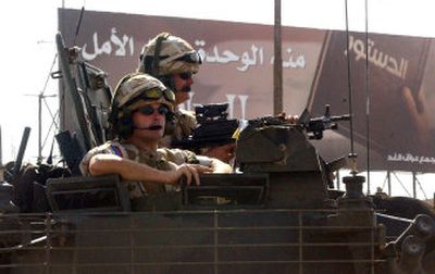 
British soldiers ride atop an armored combat vehicle in Basra, Iraq, on Sunday. 
 (Associated Press / The Spokesman-Review)