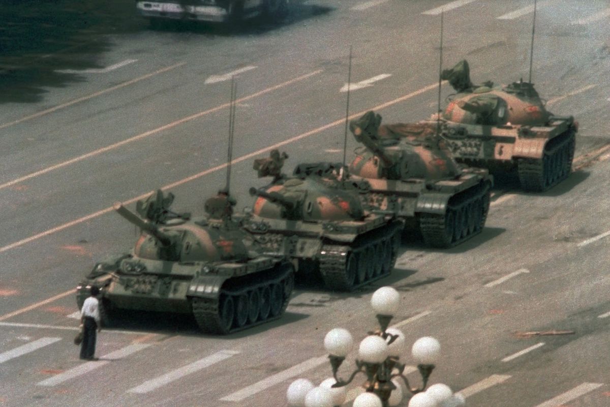 A Chinese man blocks a line of tanks in Beijing’s Tiananmen Square on June 5, 1989. This iconic picture was taken by photographer Jeff Widener during the mass protests. (Associated Press)