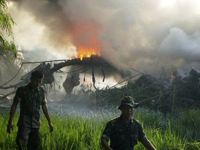 Fire consumes an Indonesian Air Force C-130 cargo plane after it crashed in Indonesia’s East Java province today. The plane was carrying 112 people.  (Associated Press / The Spokesman-Review)